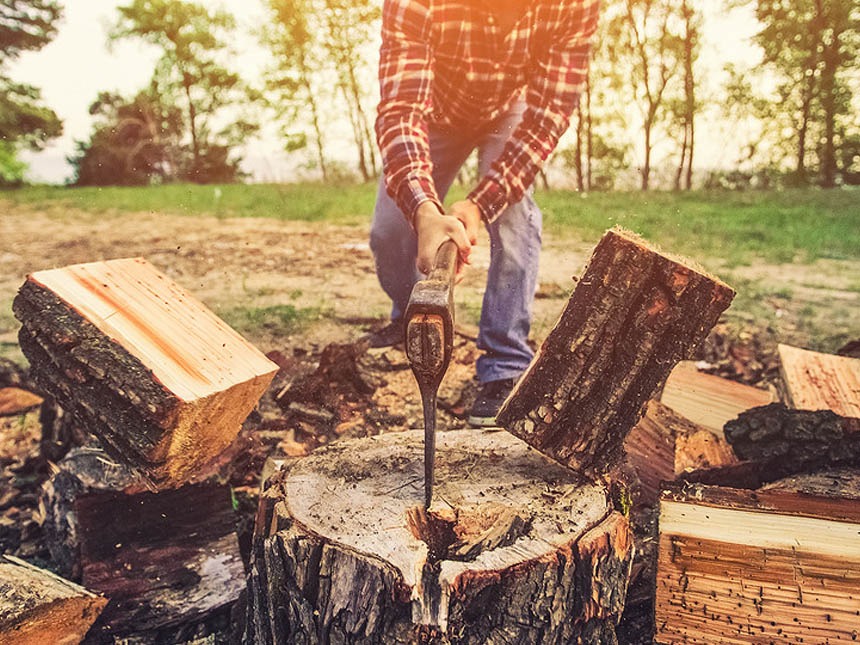 Man Splitting Wood